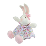 Plush rabbit toy with a floral dress and pink bow on a white background