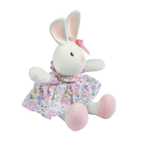 Plush rubber rabbit toy with a floral dress on a white background