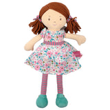 Soft rag doll with brown hair with pigtails wearing a floral pink and turquoise dress, stripey tights and turquoise shoes