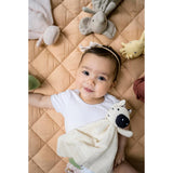 Baby surrounded by animal comforters