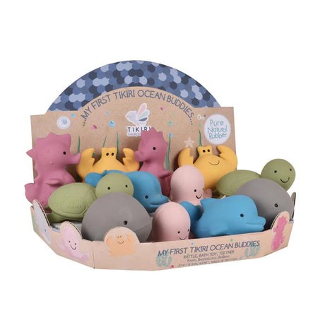 Set of colorful rubber toys in a Tikiri packaging on a white background