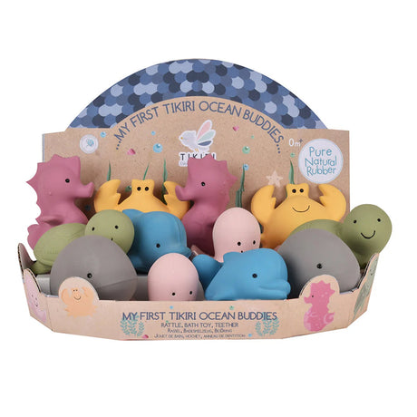 Set of colorful rubber toys in a TIKIURI packaging on a white background