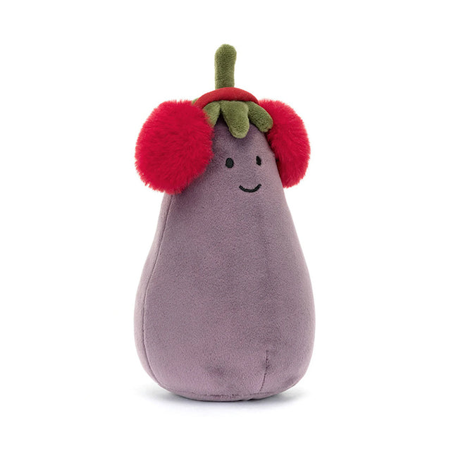 A plush toy resembling an aubergine with a smiling face, wearing fluffy red earmuffs with a green leaf on top, on a white background.