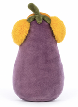 A plush toy resembling an aubergine wearing yellow earmuffs, and a soft purple body.