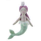 Stuffed mermaid toy with purple hair and a silver crown and green tail on a white background