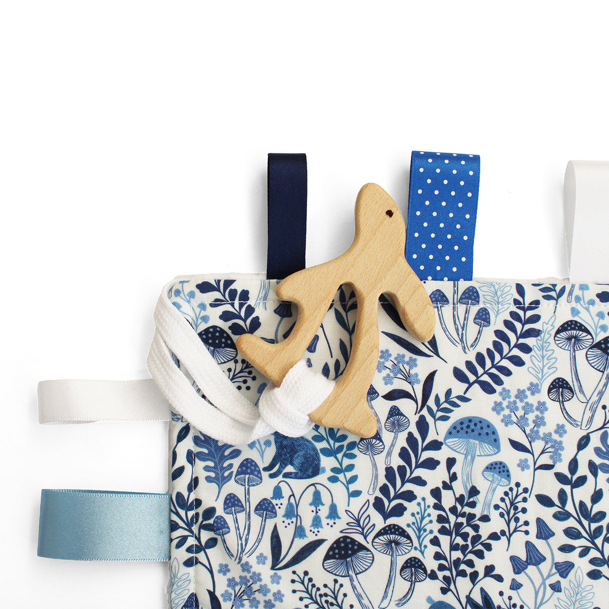 Baby wooden rabbit teething toy with fabric blue and white patterned fabric taggy comforter