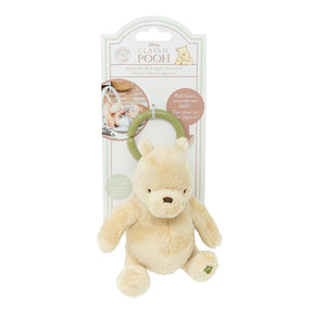 Plush Classic Pooh jiggle toy with a green attachable  ring packaged with branding on a white background.
