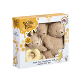 Disney Winnie the Pooh Soft Toy, Comforter and Rattle Gift Set in its packaging, featuring plush teddy bears and a yellow rattle visible through a clear window on a white background.