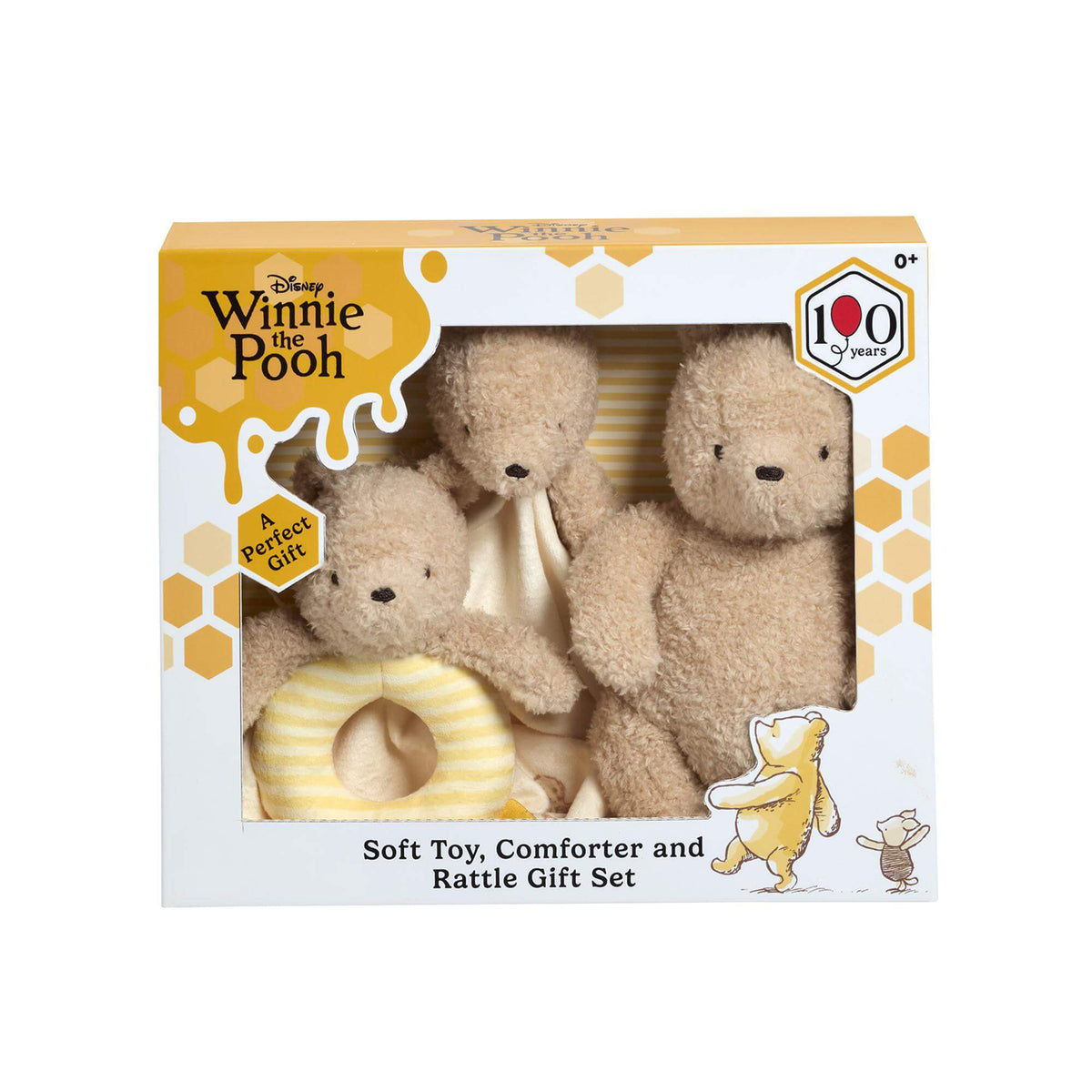 Disney Winnie the Pooh soft toy, comforter, and rattle gift set in its retail packaging, featuring plush teddy bear and a striped rattle visible through a clear window on a white background.