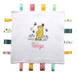 Personalised Winnie the Pooh taggy comforter with white fleece front and multiple colorful satin ribbons. 