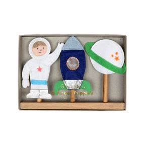Felt space-themed toys including an astronaut, rocket, and planet in a box with '3 Fingers Puppets' writen in gold and meri meri branding.