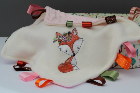 Great view of the Floral Fox Taggy Baby Comforter with colourful satin ribbons  
