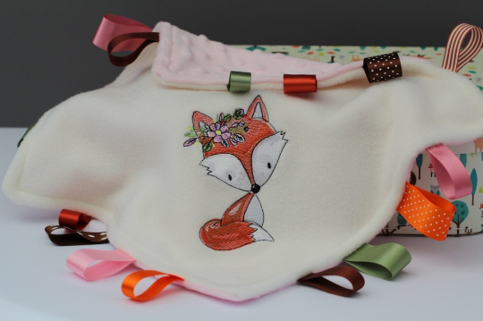 Great view of the Floral Fox Taggy Baby Comforter with colourful satin ribbons  