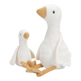 A large and small soft cuddly goose toy with a white body and wings and a orange beak and  feet