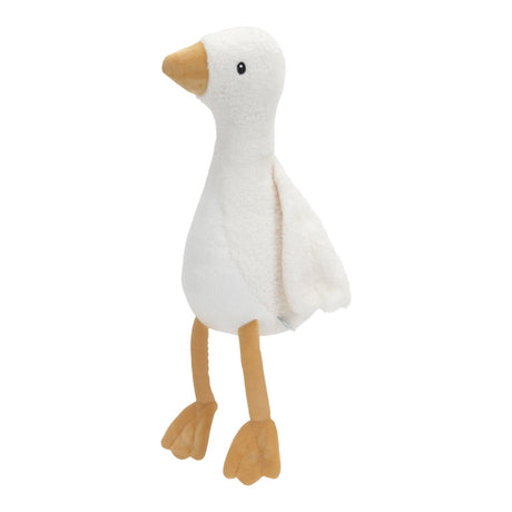A soft plush toy in the shape of a little goose with a beige body and wings, a white head, and orange beak and  feet.