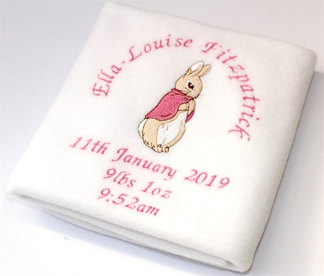 A beautifully handmade personalised and embroidered Beatrix Potter Flopsy Bunny Blanket with name and date around the bunny  