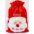 A large red personalised Santa Sack with large red nose, Ho Ho Ho across Santa's Face and embroidered name across the hat