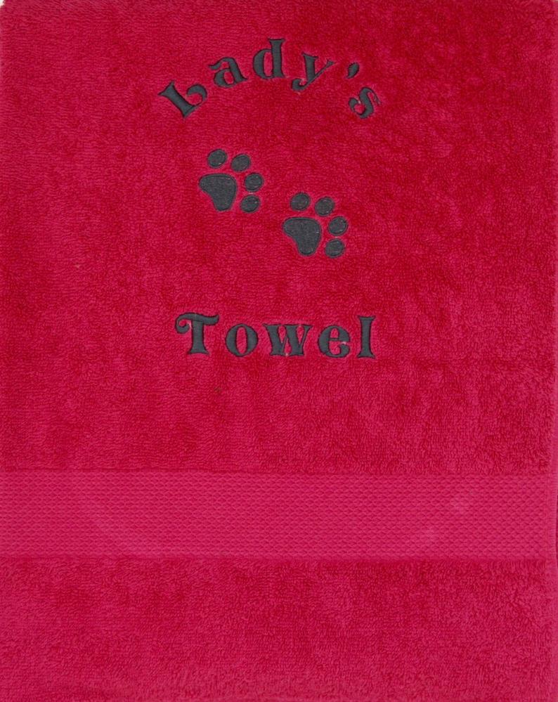 A large size red Personalised Dog Bath Towel with name and paw prints