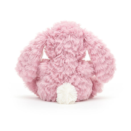 A plush toy resembling a pink bunny with a soft tummy, long ears, and a bobtail.