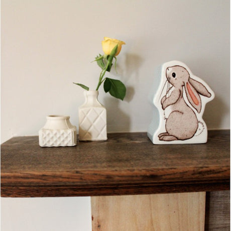 A charming money box. Crafted from flawless, pure china, it took the form of an adorable bunny