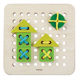 two houses made by a Plan Toys Eco Friendly Lacing Board