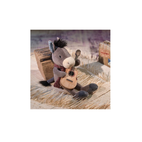 Ragtales Pedro the Donkey at home with guitar has a cosy knitted scarf, mismatched ears, a stripy tail and a soft furry mane.