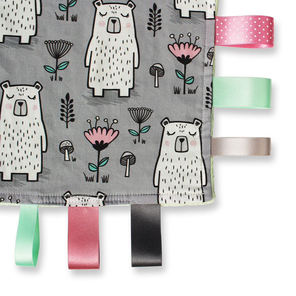 close up view of a lovely unique handmade Baby Taggy comforter which can be personalised.