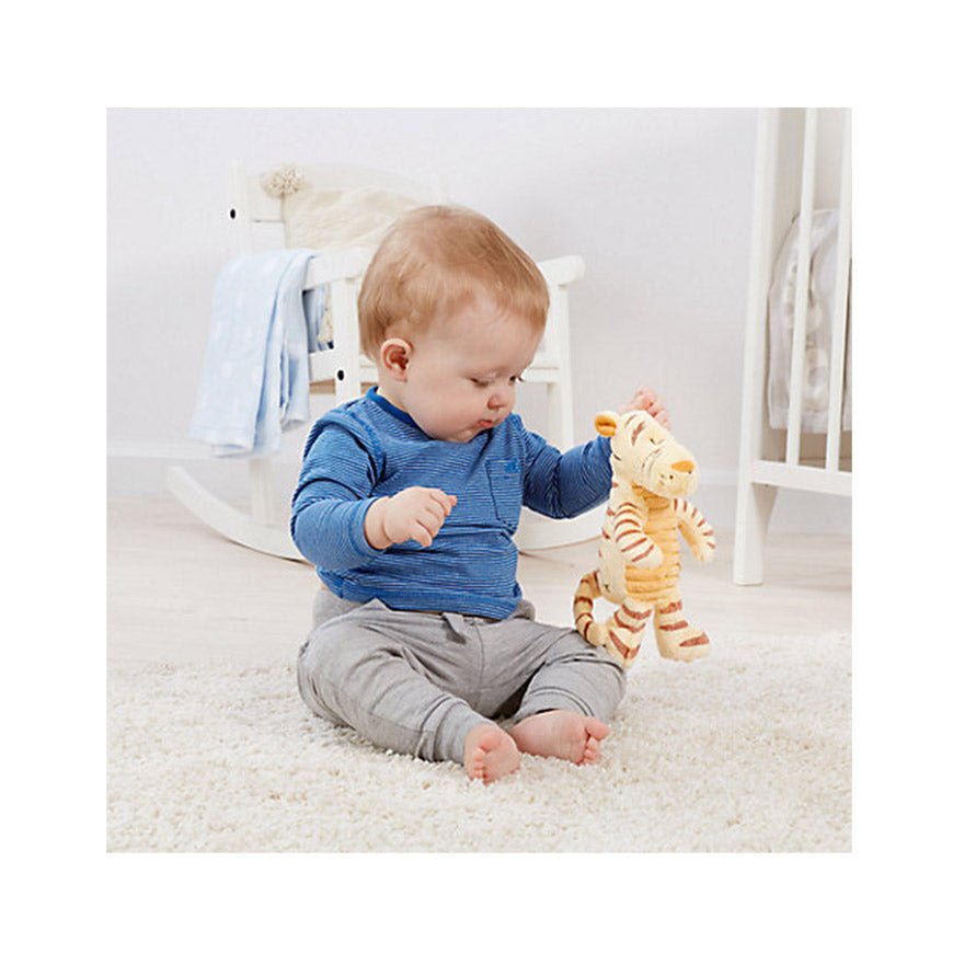 Lovely Baby playing with Winnie the Pooh Tigger Disney 15cm soft toy with brown strips 