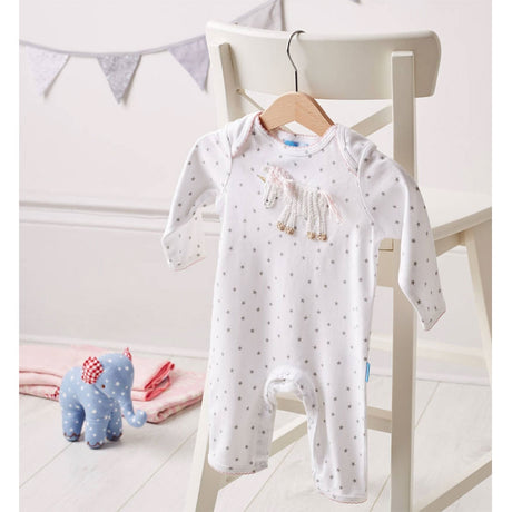 Albetta babygrow with a beautiful hand crocheted unicorn - would make the perfect baby gift for a little girl. hanging up on a chair