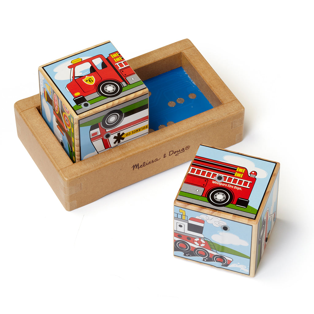 Melissa & Doug Vehicle Sound Block displaying one wooden blocks picturing a fire engine, jet plane, locomotive, tugboat, ambulance and motorcycle